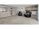 Spacious living room with wood paneling, a brick fireplace, built in shelving and comfortable seating at 3173 Long Avenue Ext., Conway, SC 29526