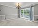 Inviting living room with large window and view of the outdoor pool and greenery at 3173 Long Avenue Ext., Conway, SC 29526