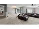 Open-concept living room with cozy seating, chandelier, and a seamless flow at 3173 Long Avenue Ext., Conway, SC 29526