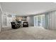 Spacious living room featuring a cozy fireplace and sliding glass doors at 3173 Long Avenue Ext., Conway, SC 29526