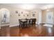 Elegant dining room featuring hardwood floors, a chandelier, and seating for six, perfect for Gathering meals at 325 Galway Ct., Longs, SC 29568