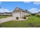 Well maintained home with a spacious driveway and a manicured lawn with lush shrubs at 325 Galway Ct., Longs, SC 29568