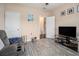 A comfortable living room featuring a TV, hardwood-style floors, and neutral paint at 325 Galway Ct., Longs, SC 29568