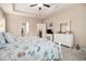 Comfortable primary bedroom with neutral walls, tray ceiling, carpet, and access to an ensuite bathroom and walk-in closet at 325 Galway Ct., Longs, SC 29568
