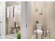 Bathroom boasts a glass-enclosed shower with tile surround and adjacent commode at 325 Galway Ct., Longs, SC 29568