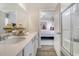 Bright bathroom features double sinks and a view into an adjacent bedroom at 3420 Logan St., Conway, SC 29526