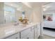 Bright bathroom features double sinks and a view into an adjacent bedroom at 3420 Logan St., Conway, SC 29526