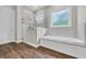 Bright bathroom with marble tile, glass shower and soaking tub at 3995 Tillmond Dr., Conway, SC 29526