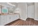 Bright bathroom with double vanity, granite counters and wood look flooring at 3995 Tillmond Dr., Conway, SC 29526