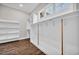 Spacious walk-in closet with custom shelving and wood look flooring at 3995 Tillmond Dr., Conway, SC 29526