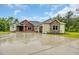 Beautiful home with a two-car garage and a combination of tan siding and red brick features at 3995 Tillmond Dr., Conway, SC 29526