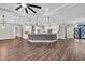 Bright open-concept living area featuring a gray kitchen island with pendant lighting at 3995 Tillmond Dr., Conway, SC 29526
