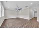 Spacious living room with a ceiling fan and wood look flooring at 3995 Tillmond Dr., Conway, SC 29526
