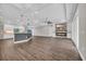 Open-concept living space featuring kitchen with island, fireplace, ceiling fan, and sliding glass doors at 3995 Tillmond Dr., Conway, SC 29526