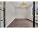 Well-lit office space featuring hardwood floors, ample natural light, and modern chandelier lighting at 3995 Tillmond Dr., Conway, SC 29526