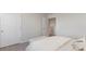 Bedroom features neutral walls, carpet and view of the open doorway to walk in closet at 406 Glade Ct., Loris, SC 29569