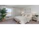 Relaxing bedroom with bench, water view, and neutral tones creating a serene atmosphere at 406 Glade Ct., Loris, SC 29569