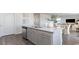 Kitchen island with stainless dishwasher and sink overlooking adjacent dining and living areas at 406 Glade Ct., Loris, SC 29569
