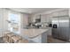 Modern kitchen with stainless steel appliances, granite countertops, and grey cabinets at 406 Glade Ct., Loris, SC 29569