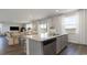 Open concept kitchen island with sink, dishwasher and barstool seating area at 406 Glade Ct., Loris, SC 29569