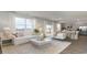 Spacious living room connecting to the kitchen, featuring hardwood floors, and abundant natural light at 406 Glade Ct., Loris, SC 29569