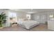 Bright main bedroom with plush carpeting, large windows, and neutral decor at 406 Glade Ct., Loris, SC 29569