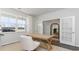 Bright and airy office with glass French doors, neutral decor, and a view to entryway at 406 Glade Ct., Loris, SC 29569