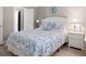 Nautical themed bedroom with wooden floors, white furniture, and bath access at 415 Ocean Creek Dr. # 2161, Myrtle Beach, SC 29572