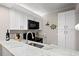Bright kitchen featuring granite countertops, white cabinets, and modern appliances, perfect for cooking and entertaining at 415 Ocean Creek Dr. # 2161, Myrtle Beach, SC 29572