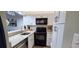 Efficient kitchen with stainless steel appliances, sleek countertops, and white cabinetry, offering modern convenience at 415 Ocean Creek Dr. # 2161, Myrtle Beach, SC 29572