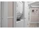 Convenient laundry area with a stackable washer and dryer unit, maximizing space and efficiency at 415 Ocean Creek Dr. # 2161, Myrtle Beach, SC 29572