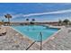 Outdoor swimming pool featuring lounge chairs, palm trees and a view of the beach at 415 Ocean Creek Dr. # 2161, Myrtle Beach, SC 29572