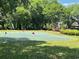 Well-maintained putting green surrounded by lush greenery, offering a relaxing recreational amenity at 415 Ocean Creek Dr. # 2161, Myrtle Beach, SC 29572