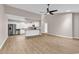 An open kitchen and living area with stainless appliances and light countertops at 4339 Baldwin Ave. # 4339, Little River, SC 29566