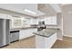 Bright kitchen with granite countertops, stainless appliances, and white cabinets at 4339 Baldwin Ave. # 4339, Little River, SC 29566