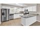 Modern kitchen features stainless appliances, granite countertops and bar-style seating at 4339 Baldwin Ave. # 4339, Little River, SC 29566