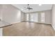 A spacious living room with vaulted ceilings, natural lighting, and wood flooring at 4339 Baldwin Ave. # 4339, Little River, SC 29566