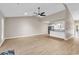Open-concept living room showcases wood floors, neutral walls and seamless transition to kitchen at 4339 Baldwin Ave. # 4339, Little River, SC 29566