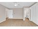 Main bedroom boasts wood floors, ceiling fan, and an ensuite bathroom with tiled shower at 4339 Baldwin Ave. # 4339, Little River, SC 29566