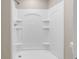 Tiled shower stall boasts built-in shelving and a modern shower head at 4339 Baldwin Ave. # 4339, Little River, SC 29566