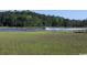 Scenic inter-coastal waterway view with a passing motorboat amidst thriving marshland under a clear blue sky at 4339 Baldwin Ave. # 4339, Little River, SC 29566