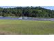 A motorboat navigates the inter-coastal waterway adjacent to lush green marshland under a clear blue sky at 4339 Baldwin Ave. # 4339, Little River, SC 29566