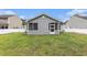 Backyard featuring a screened porch and a well-maintained lawn at 436 Cotton Grass Dr., Loris, SC 29569