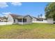 Spacious backyard showcasing a screened-in porch and a storage shed at 436 Cotton Grass Dr., Loris, SC 29569