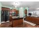 Well-equipped kitchen with wood cabinets, granite countertops, and a functional center island at 436 Cotton Grass Dr., Loris, SC 29569