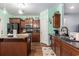 Well-equipped kitchen with wood cabinets, granite countertops, and a functional center island at 436 Cotton Grass Dr., Loris, SC 29569