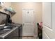 Convenient laundry room with modern appliances and shelving for storage at 436 Cotton Grass Dr., Loris, SC 29569