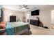 Bright primary bedroom with a ceiling fan, TV, and a queen bed at 436 Cotton Grass Dr., Loris, SC 29569