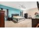 Bright primary bedroom with an accent wall, ceiling fan, and a queen bed at 436 Cotton Grass Dr., Loris, SC 29569