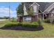 Welcoming community entrance sign 'Red Bluff' with manicured landscaping at 436 Cotton Grass Dr., Loris, SC 29569